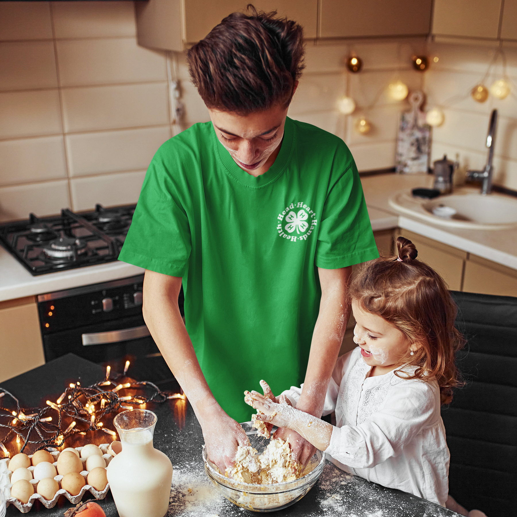 https://shop4-h.org/cdn/shop/files/t-shirt-mockup-of-a-teen-baking-with-his-little-sister-at-home-m2147-r-el2_1800x.png?v=1697627174